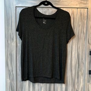 A New Day ladies Size Large T shirt in black with gold sparkles.  Short sleeve.